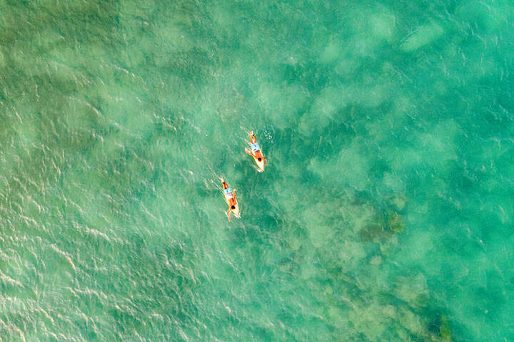 Aerial view of surfers in Lombok