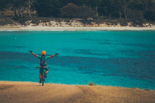 Mountain biking against a typically epic Tasmanian backdrop, Maria Island National Park