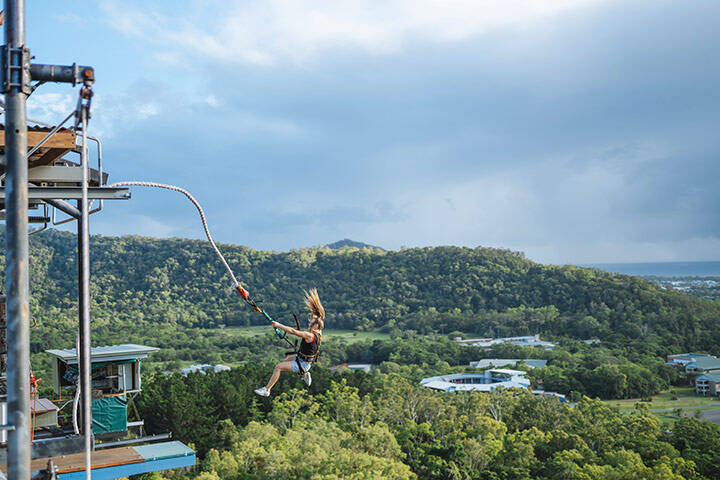 Lady falling through the air on her bungy jump at Skypark Cairns by AJ Hackett