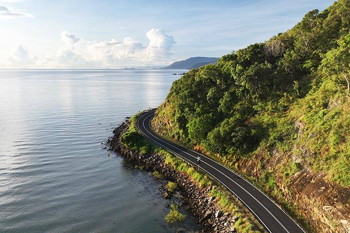  Cars driving along the coastal highway from Cairns to Port Douglas