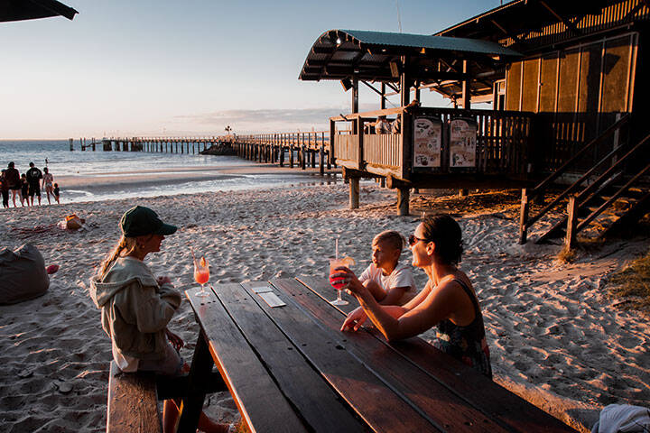 Family enjoying the sunset at Kingfisher Bay Resort